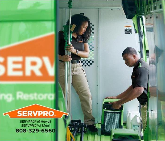 SERVPRO professionals are loading equipment in response to a water damage emergency. 