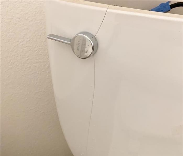 toilet tank with a crack and leak