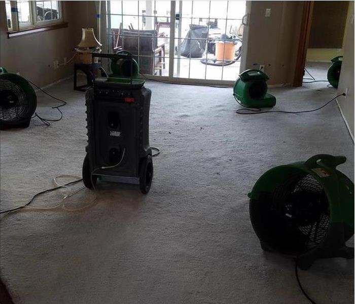 Drying equipment set up in an apartment facing a front window