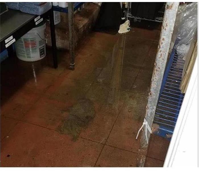 commercial kitchen floor with standing water