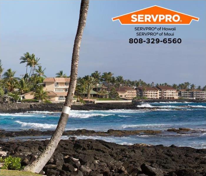 Oceanfront apartments can be seen along the Kona coastline. 